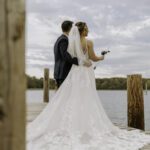 wedding couple fishing at lakeside dock