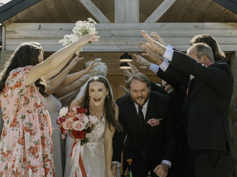 A Vibrant Fall Wedding at C&C by the Lake: Bright Pink and Red Hues, a Bubble Exit, and a Stunning Fireworks Finale