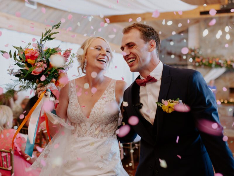 Beautiful bridal bouquet with bright, colorful summer florals from C&C by the Lake’s in-house florist